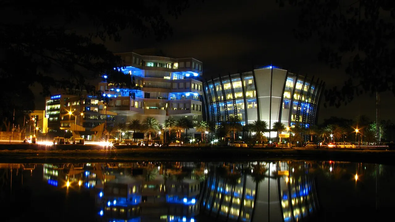 Bagmane Tech Park in Bengaluru lit up at night and reflected in a lake